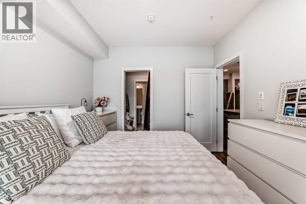316, 200 Shawnee Square Sw, Calgary, AB - Indoor Photo Showing Bedroom