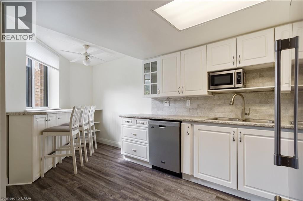 3499 Upper Middle Road Unit# 211, Burlington, ON - Indoor Photo Showing Kitchen With Double Sink