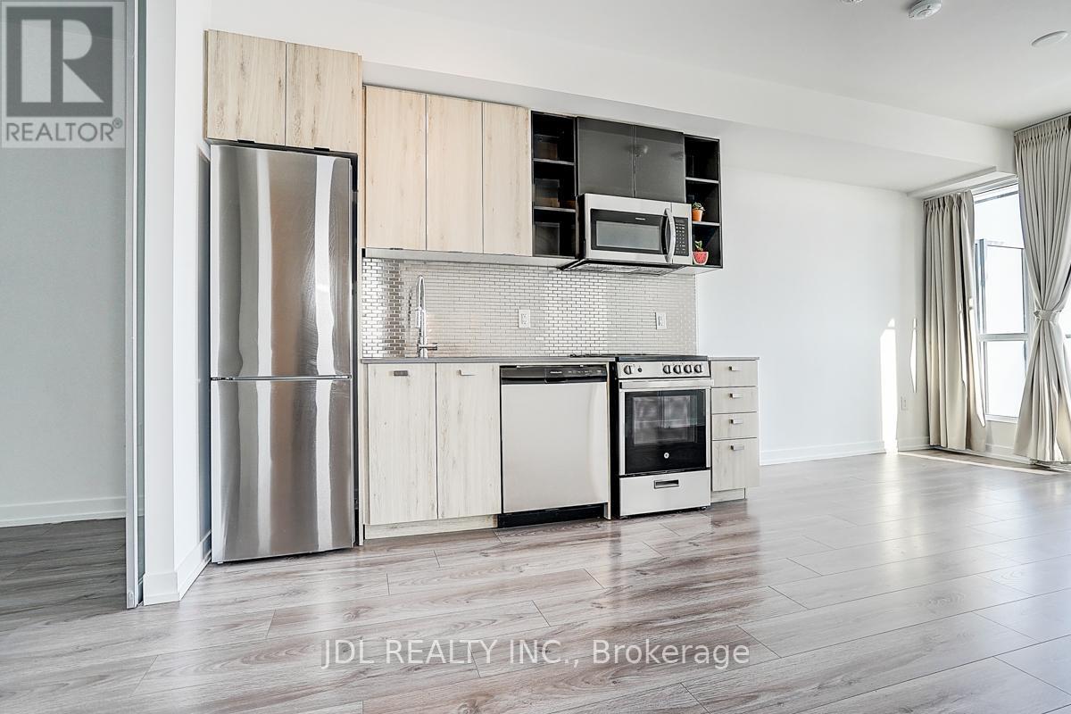 808 - 10 De Boers Drive, Toronto, ON - Indoor Photo Showing Kitchen With Stainless Steel Kitchen