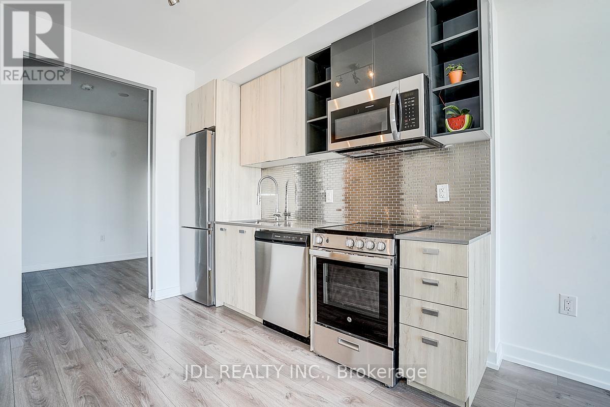 808 - 10 De Boers Drive, Toronto, ON - Indoor Photo Showing Kitchen With Stainless Steel Kitchen With Upgraded Kitchen