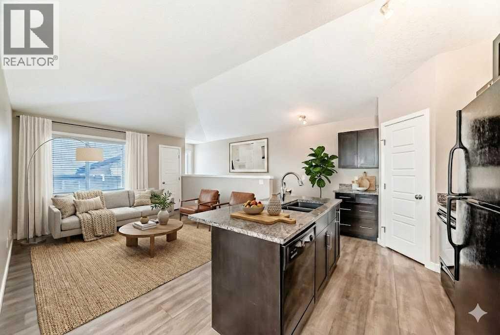 Staged Living Room - 11302, 2781 Chinook Winds Drive Sw, Airdrie, AB - Indoor Photo Showing Kitchen With Double Sink With Upgraded Kitchen