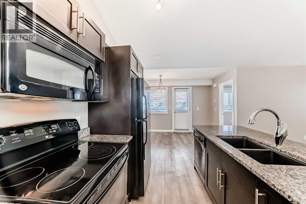 11302, 2781 Chinook Winds Drive Sw, Airdrie, AB - Indoor Photo Showing Kitchen With Double Sink