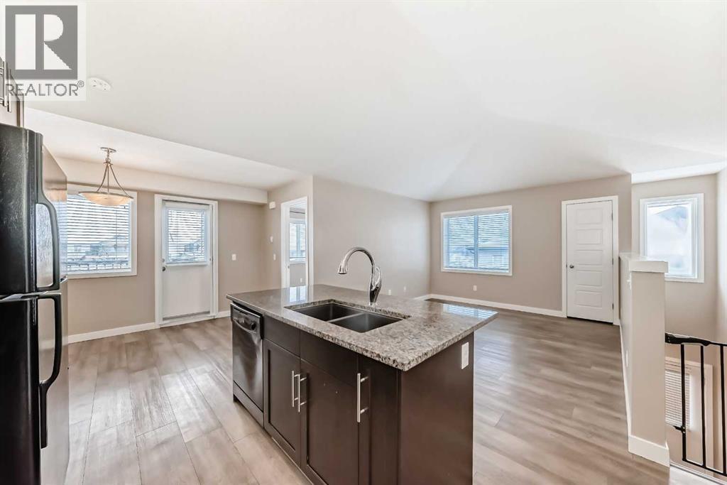 Current Living Room - 11302, 2781 Chinook Winds Drive Sw, Airdrie, AB - Indoor Photo Showing Kitchen With Double Sink