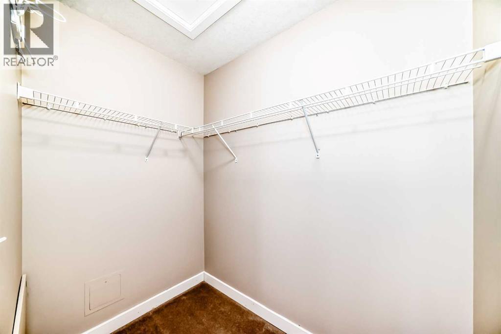 Huge Walk in Closet - 11302, 2781 Chinook Winds Drive Sw, Airdrie, AB - Indoor With Storage