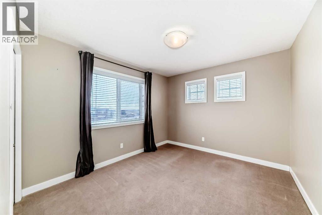 Current Second Bedroom. Windows on 2 walls for extra sunlight - 11302, 2781 Chinook Winds Drive Sw, Airdrie, AB - Indoor Photo Showing Other Room