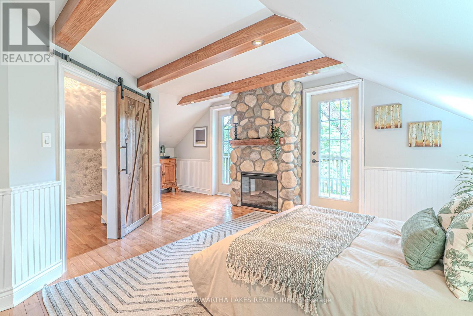 7725 Leskard Road N, Clarington, ON - Indoor Photo Showing Bedroom With Fireplace
