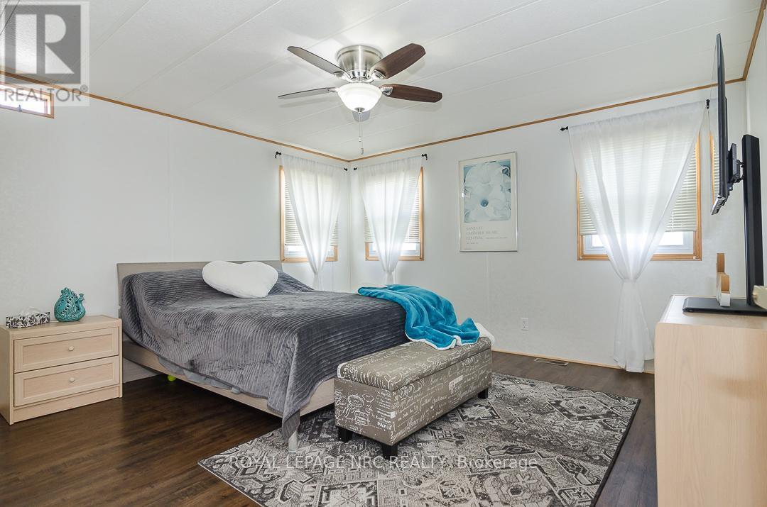 Primary Bedroom - 254 - 3033 Townline Road, Fort Erie (Black Creek), ON - Indoor Photo Showing Bedroom