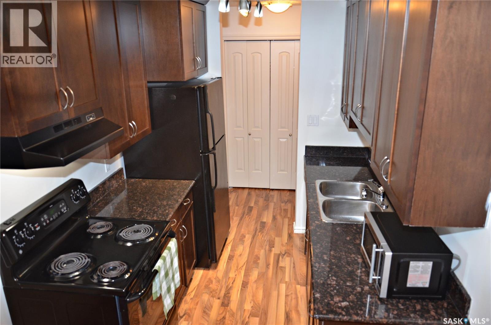 307 2233 St Henry Avenue, Saskatoon, SK - Indoor Photo Showing Kitchen With Double Sink