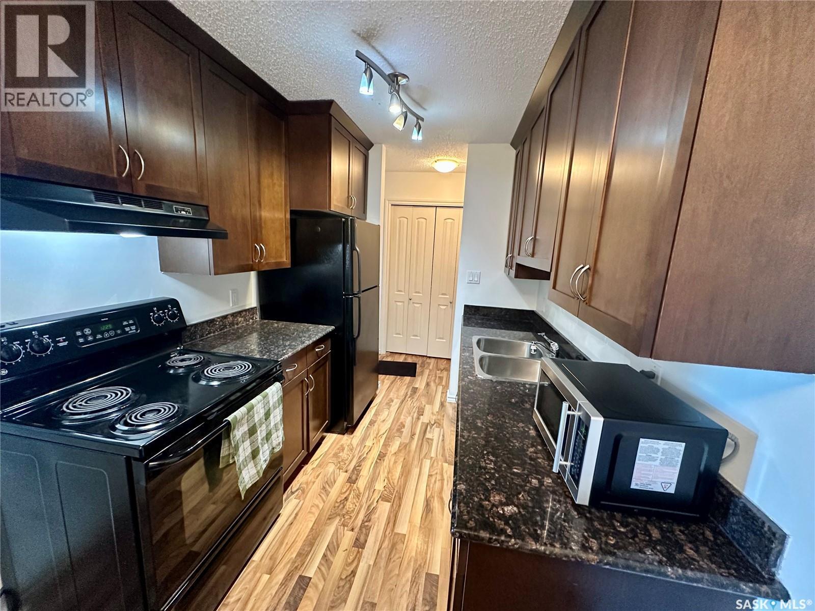 307 2233 St Henry Avenue, Saskatoon, SK - Indoor Photo Showing Kitchen With Double Sink
