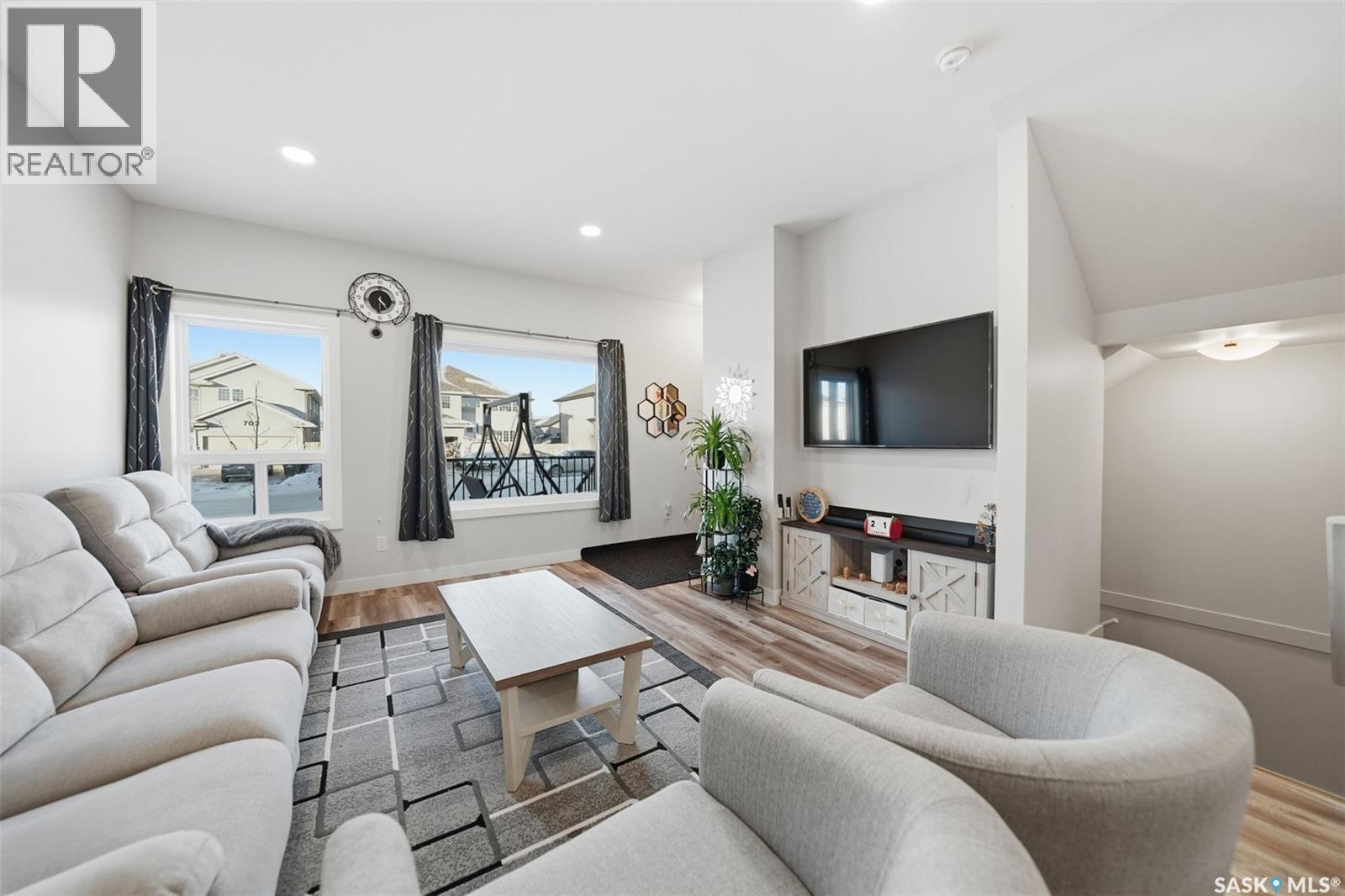705 Evergreen Boulevard, Saskatoon, SK - Indoor Photo Showing Living Room With Fireplace