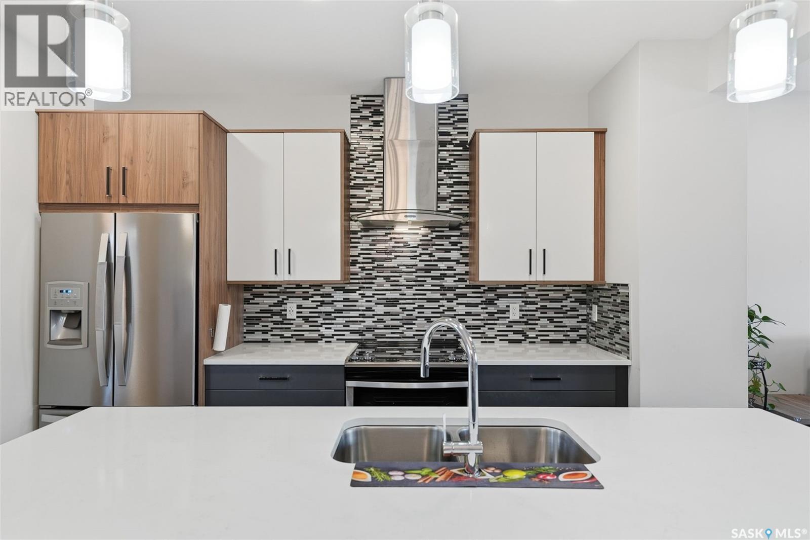 705 Evergreen Boulevard, Saskatoon, SK - Indoor Photo Showing Kitchen With Double Sink