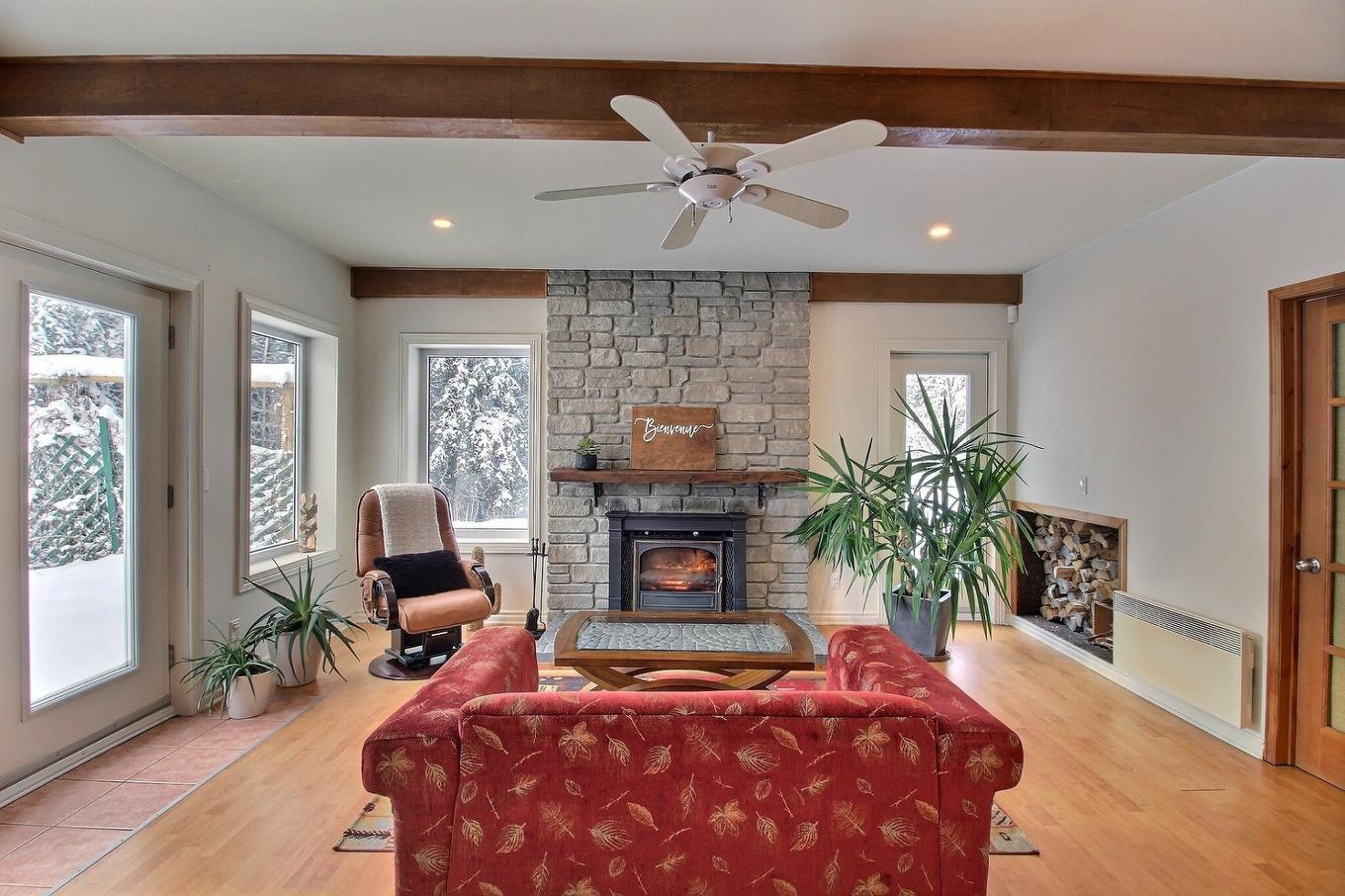 Salon - 157 Sent. Des Fougères, Val-D'Or, QC - Indoor Photo Showing Living Room With Fireplace
