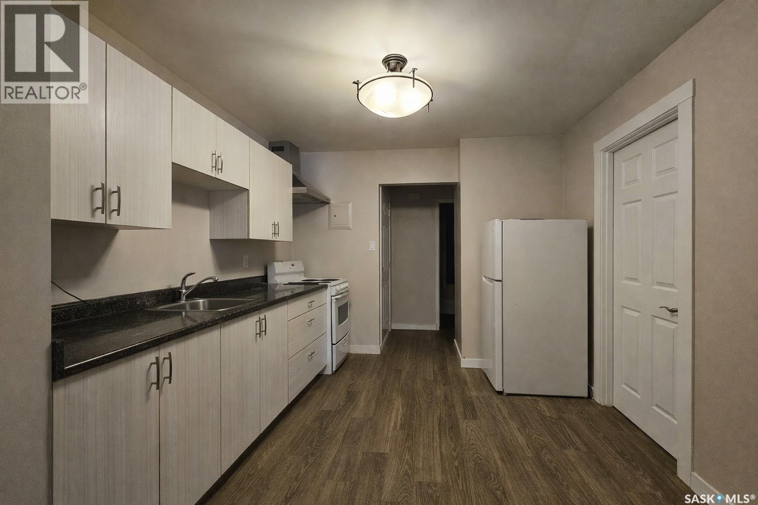 1411 111Th Street, North Battleford, SK - Indoor Photo Showing Kitchen With Double Sink