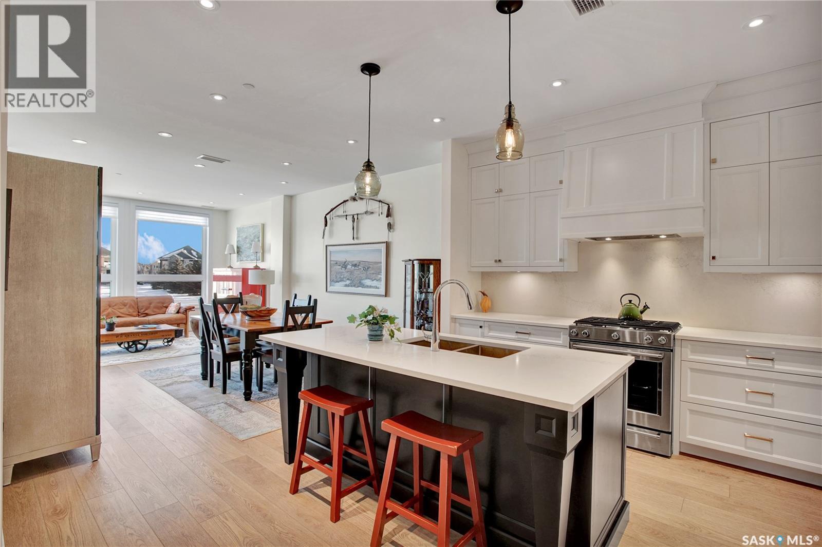 104 408 Cartwright Street, Saskatoon, SK - Indoor Photo Showing Kitchen With Double Sink With Upgraded Kitchen