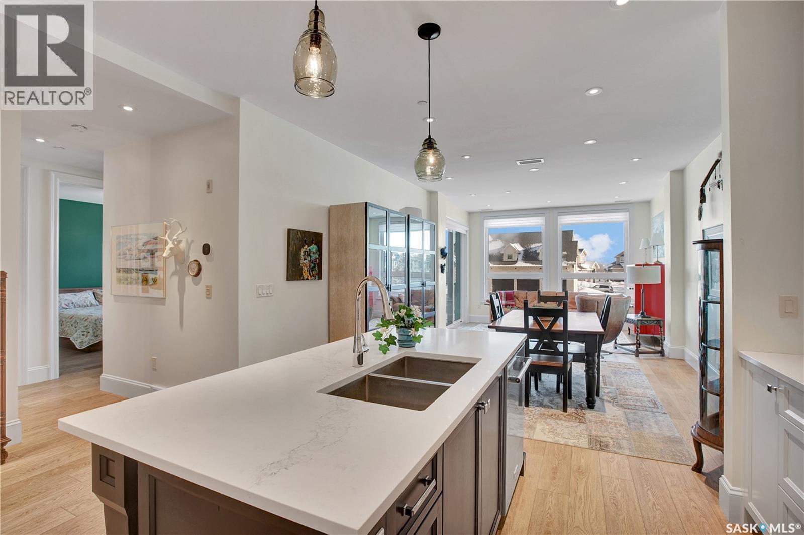 104 408 Cartwright Street, Saskatoon, SK - Indoor Photo Showing Kitchen With Double Sink With Upgraded Kitchen