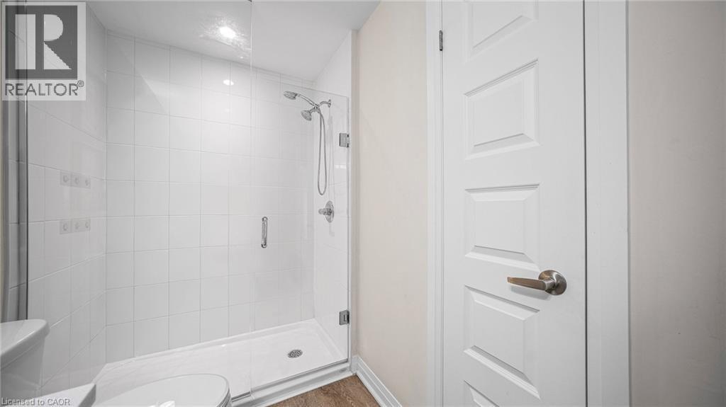 Full bathroom with a shower stall and toilet - 610 Farmstead Drive Unit# 304, Milton, ON - Indoor Photo Showing Bathroom