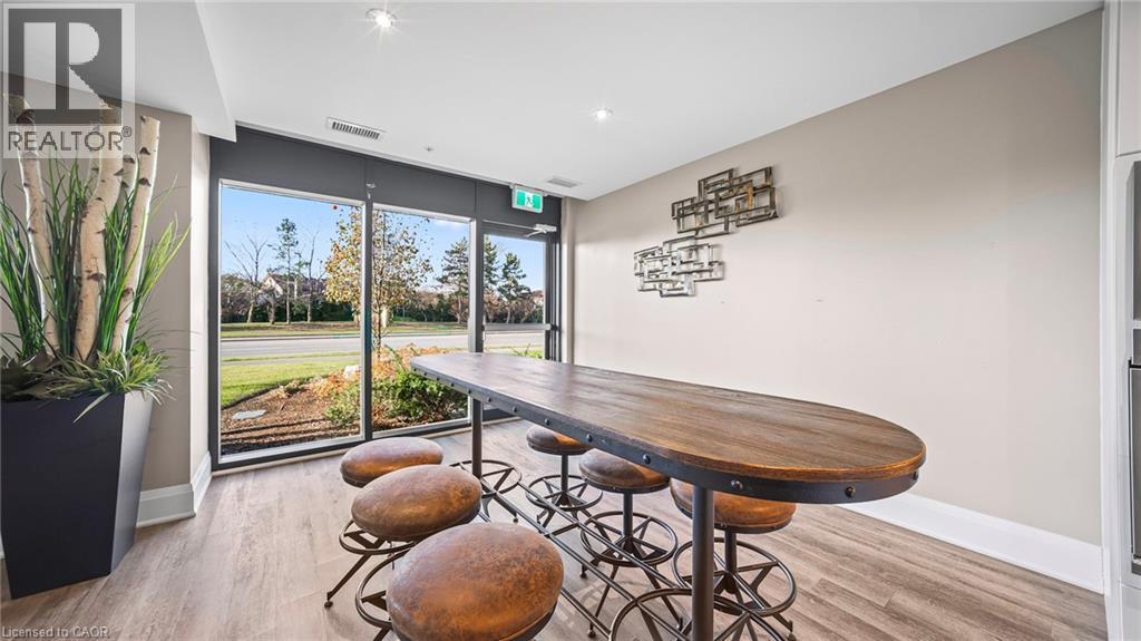 Dining room featuring light wood-style floors - 610 Farmstead Drive Unit# 304, Milton, ON - Indoor Photo Showing Other Room