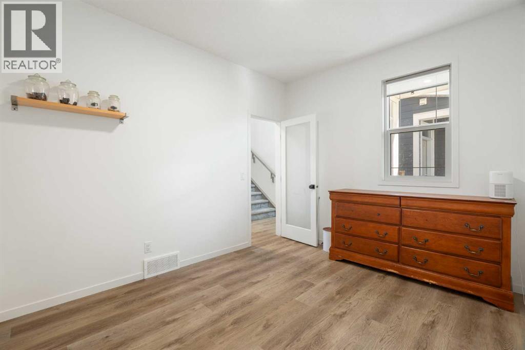 36 Magnolia Bay Se, Calgary, AB - Indoor Photo Showing Other Room