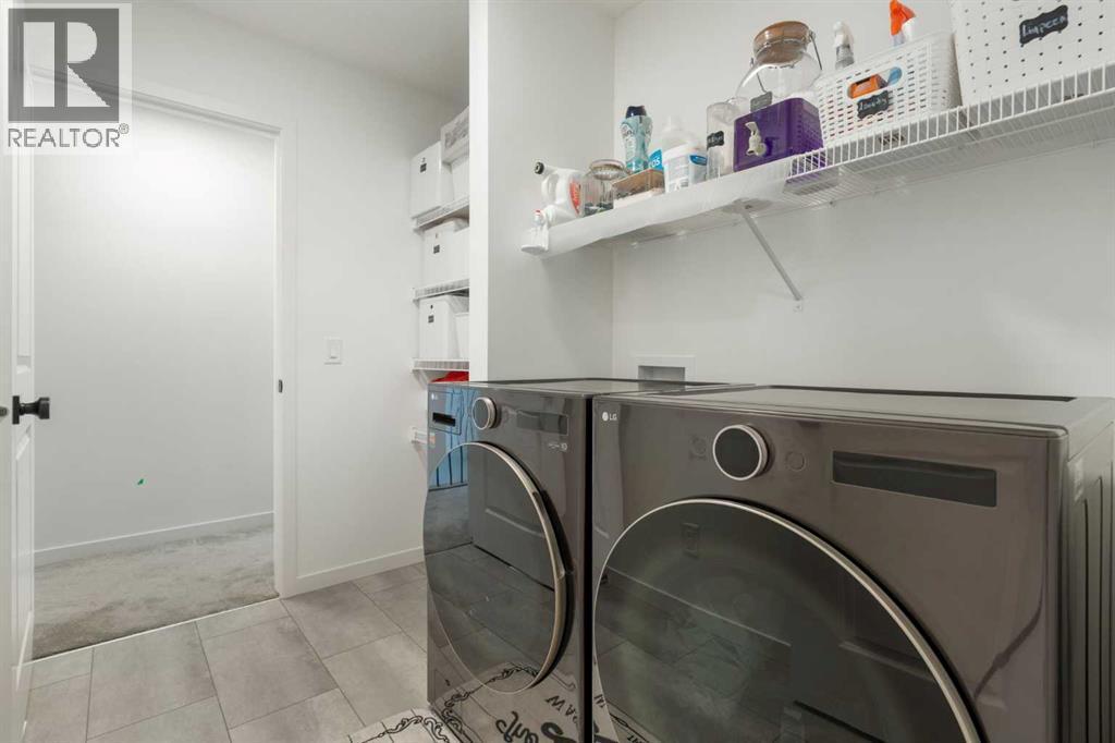 36 Magnolia Bay Se, Calgary, AB - Indoor Photo Showing Laundry Room