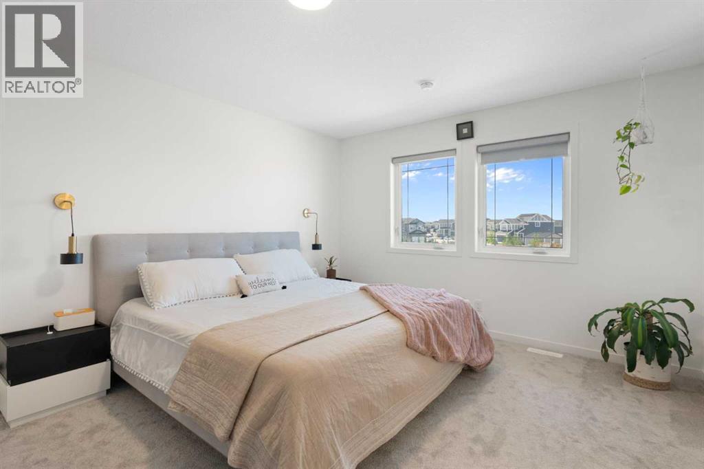 36 Magnolia Bay Se, Calgary, AB - Indoor Photo Showing Bedroom