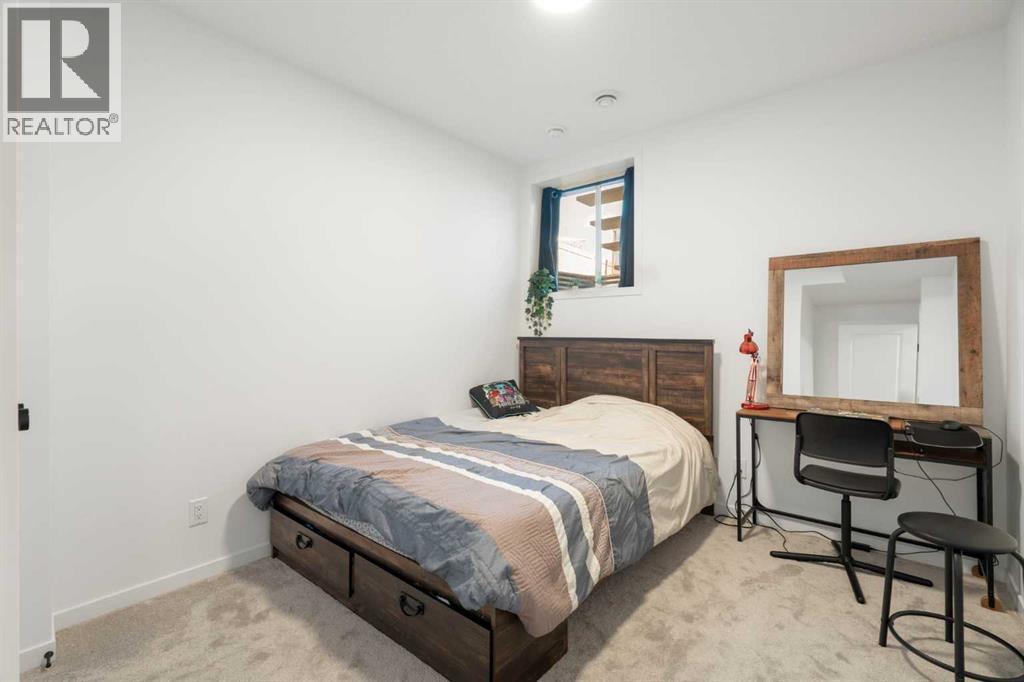 36 Magnolia Bay Se, Calgary, AB - Indoor Photo Showing Bedroom