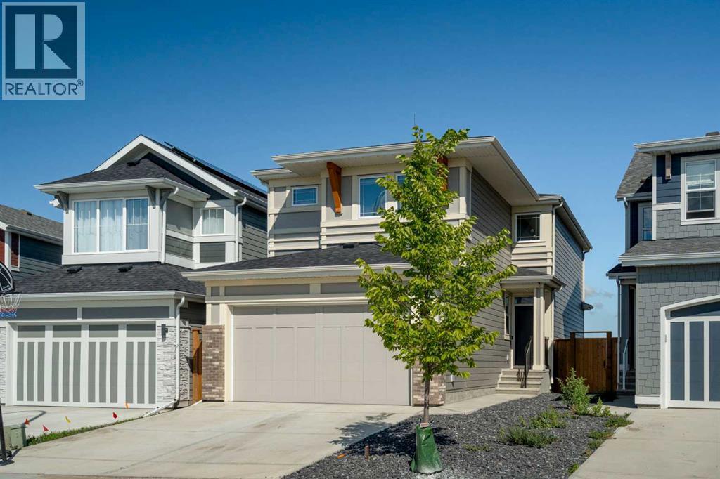 36 Magnolia Bay Se, Calgary, AB - Outdoor With Facade