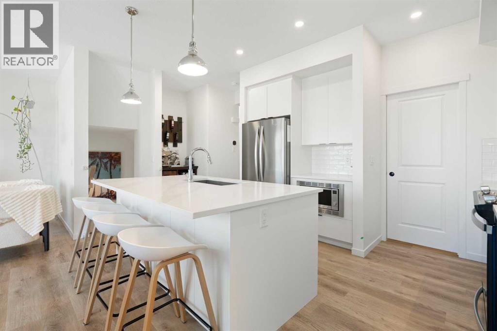 36 Magnolia Bay Se, Calgary, AB - Indoor Photo Showing Kitchen With Upgraded Kitchen