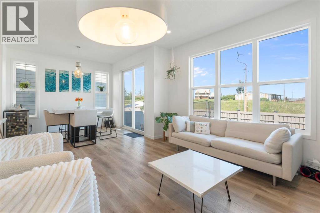 36 Magnolia Bay Se, Calgary, AB - Indoor Photo Showing Living Room