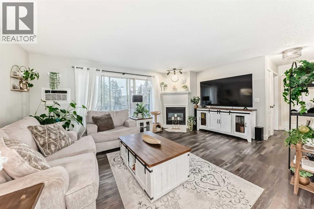 314, 5326 47 Avenue, Red Deer, AB - Indoor Photo Showing Living Room With Fireplace