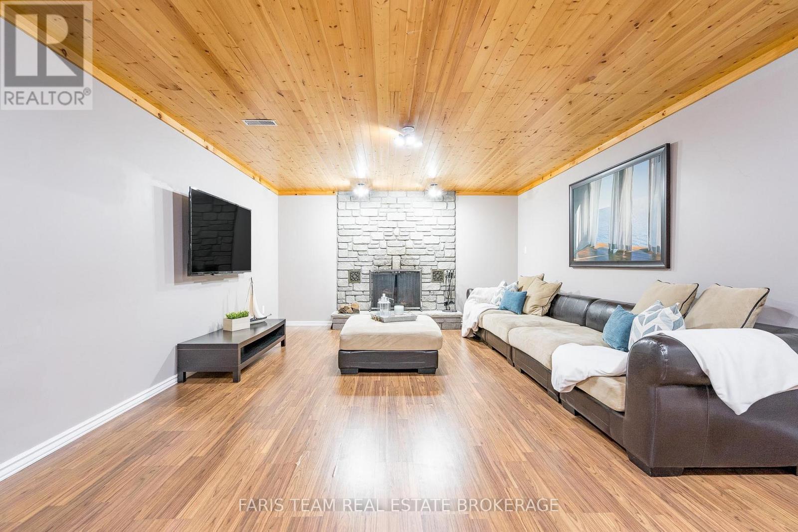 21 Maryjane Road, Tiny, ON - Indoor Photo Showing Living Room With Fireplace