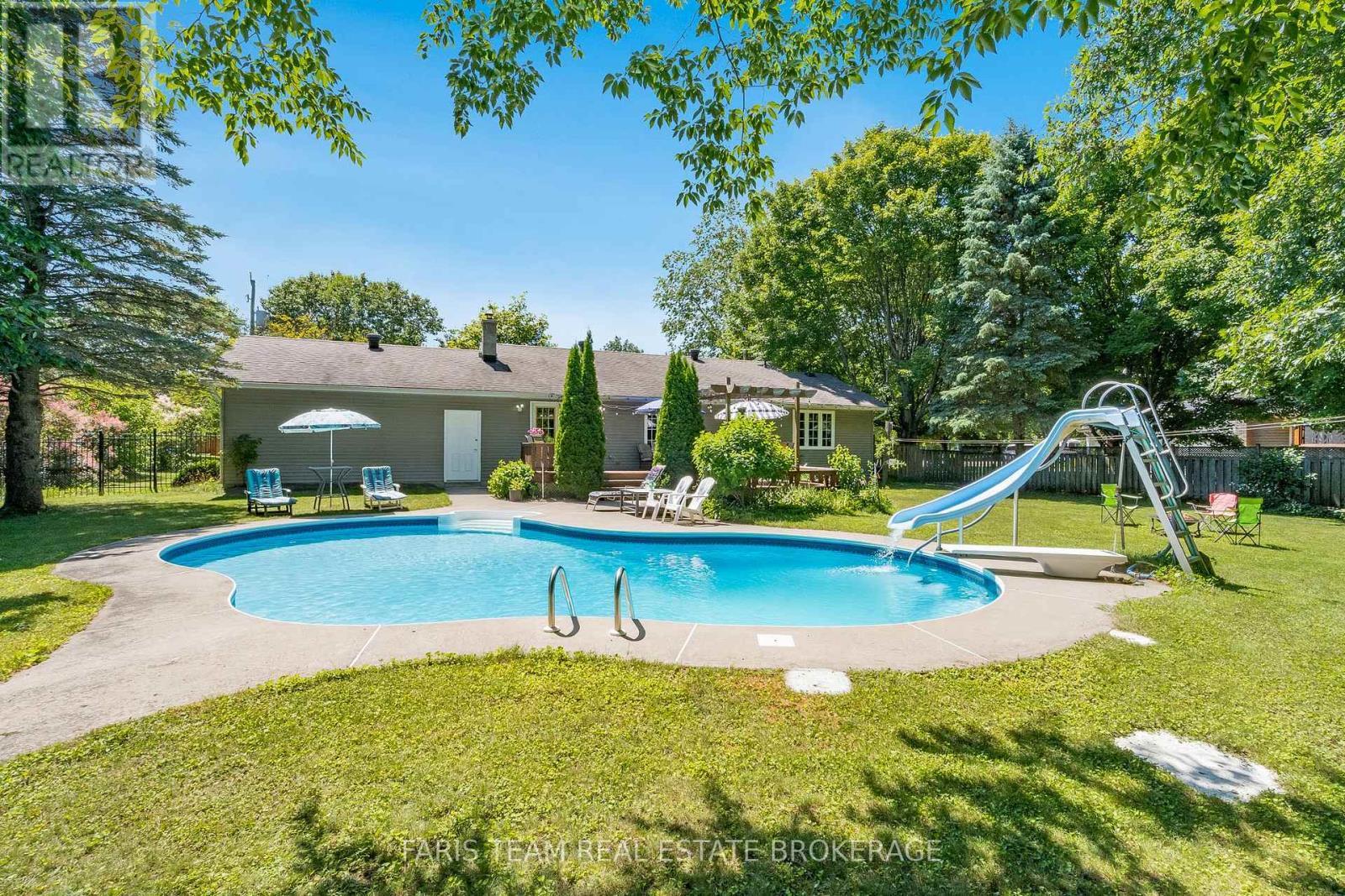 21 Maryjane Road, Tiny, ON - Outdoor With In Ground Pool With Backyard