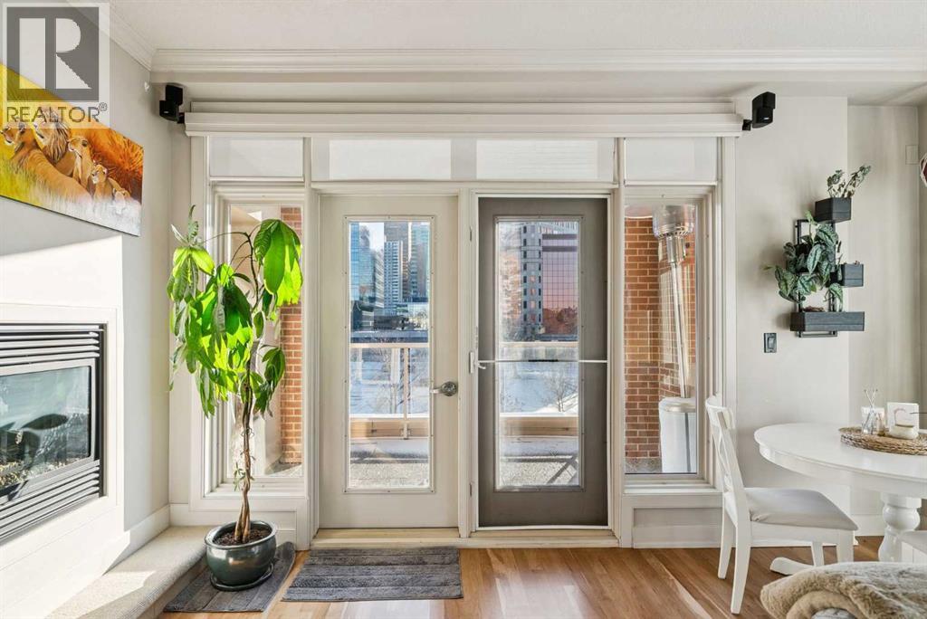 Large bright windows and surround built-in speakers - 306, 660 Eau Claire Avenue Sw, Calgary, AB - Indoor