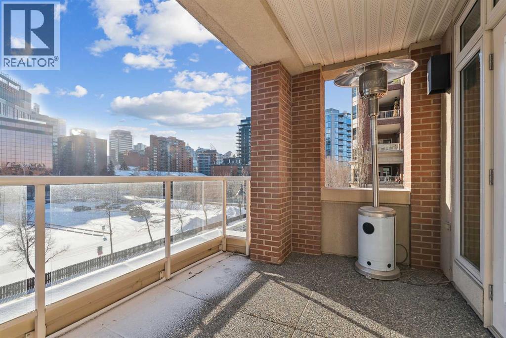 Large covered south facing balcony - 306, 660 Eau Claire Avenue Sw, Calgary, AB - Outdoor With Balcony