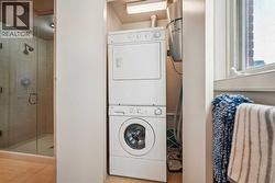 Stack washer/dryer and built-in vacuum system -