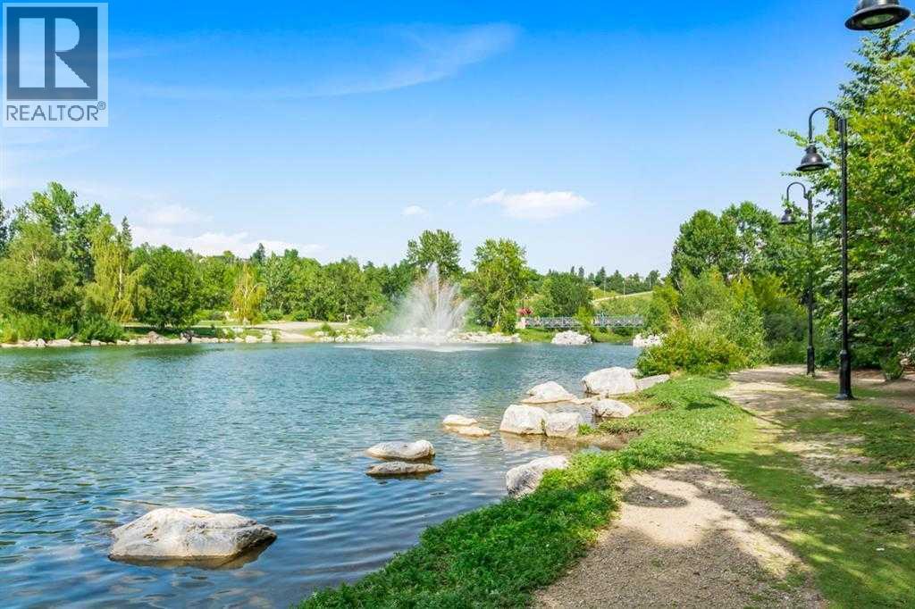 Enjoy the beauty of Prince's Island Park - 306, 660 Eau Claire Avenue Sw, Calgary, AB - Outdoor With Body Of Water With View