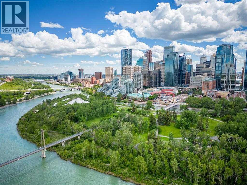 Enjoy everything this exceptional Downtown Community has to offer! - 306, 660 Eau Claire Avenue Sw, Calgary, AB - Outdoor With Body Of Water With View