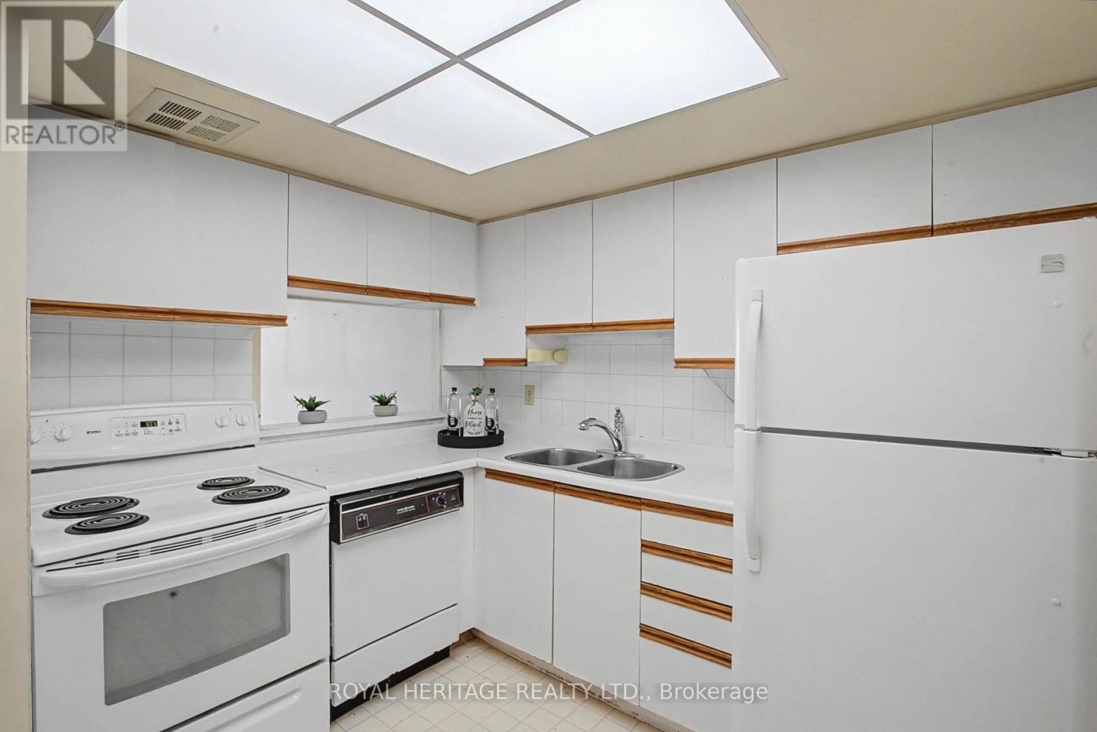 Eat-in Kitchen with pass thru. - 509 - 30 Thunder Grove, Toronto, ON - Indoor Photo Showing Kitchen With Double Sink