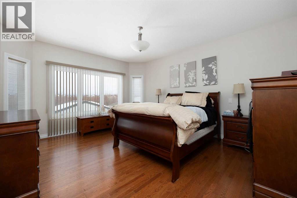 primary bedroom Hardwood floors - 237 Trillium Road, Fort Mcmurray, AB - Indoor Photo Showing Bedroom
