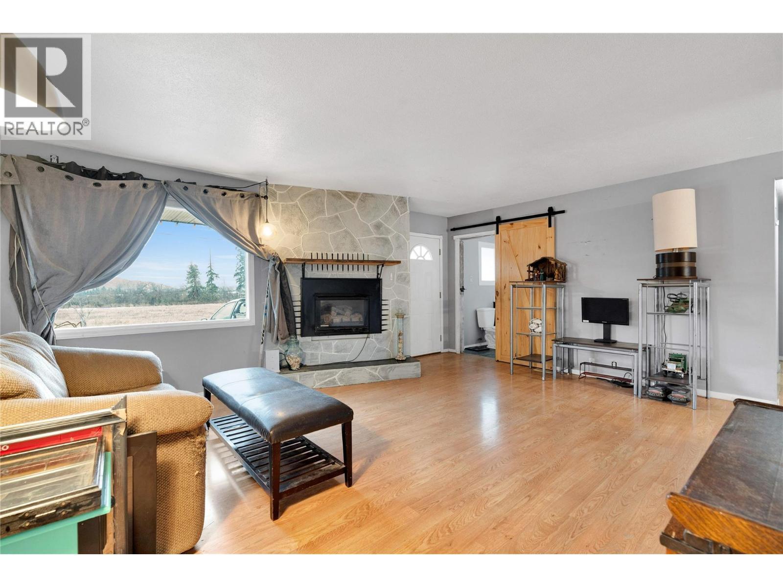 4010 Dodds Road, Armstrong, BC - Indoor Photo Showing Living Room With Fireplace
