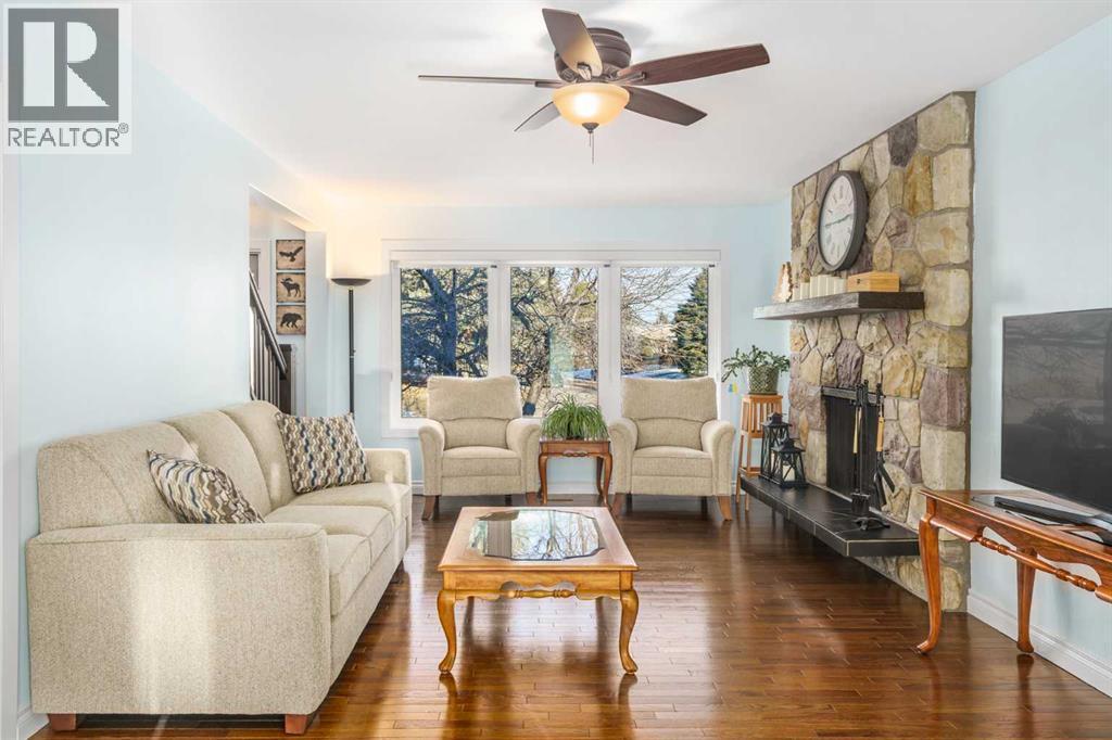 1315 Lake Michigan Crescent Se, Calgary, AB - Indoor Photo Showing Living Room With Fireplace