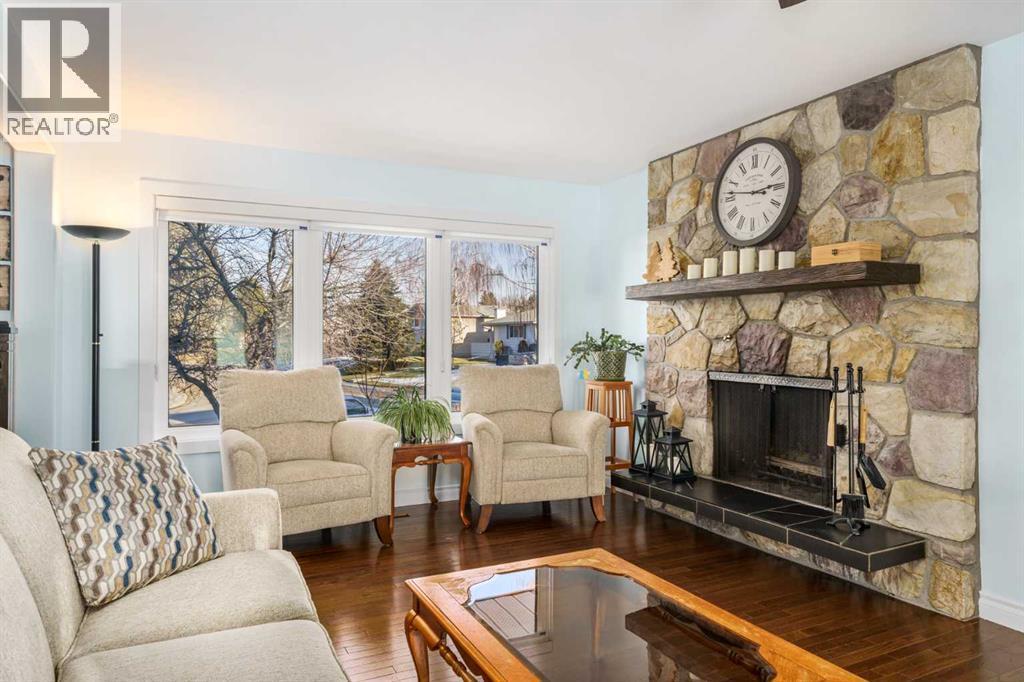 1315 Lake Michigan Crescent Se, Calgary, AB - Indoor Photo Showing Living Room With Fireplace