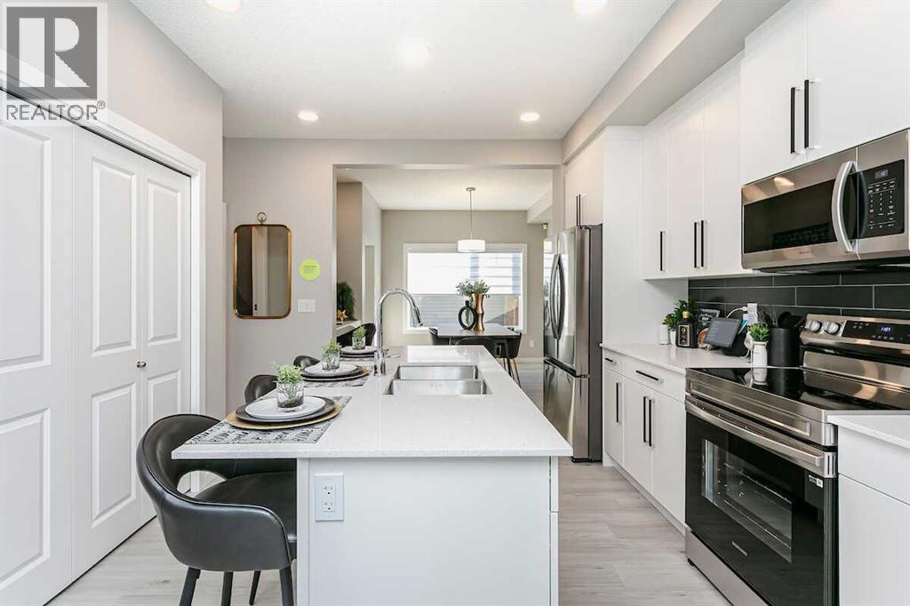 226 Heartwood Parade Se, Calgary, AB - Indoor Photo Showing Kitchen With Upgraded Kitchen