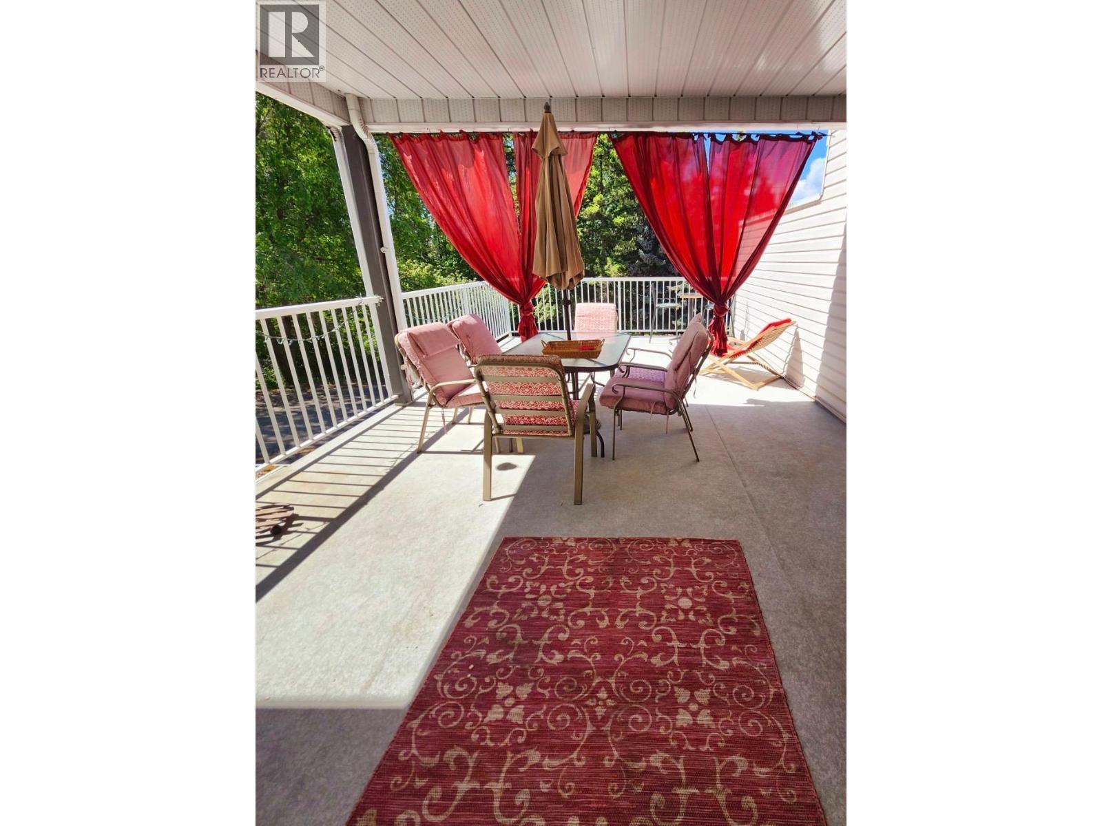 The balcony looks great in vibrant colours! - 4404 Pleasant Valley Road Unit# 6, Vernon, BC -