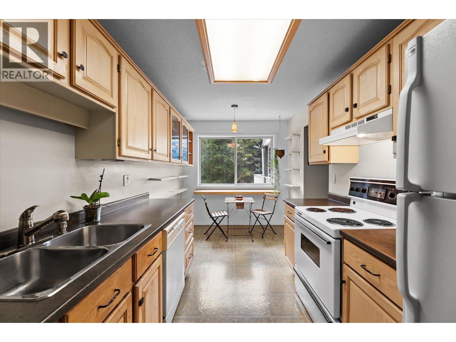 Functional kitchen design - 4404 Pleasant Valley Road Unit# 6, Vernon, BC - Indoor Photo Showing Kitchen With Double Sink