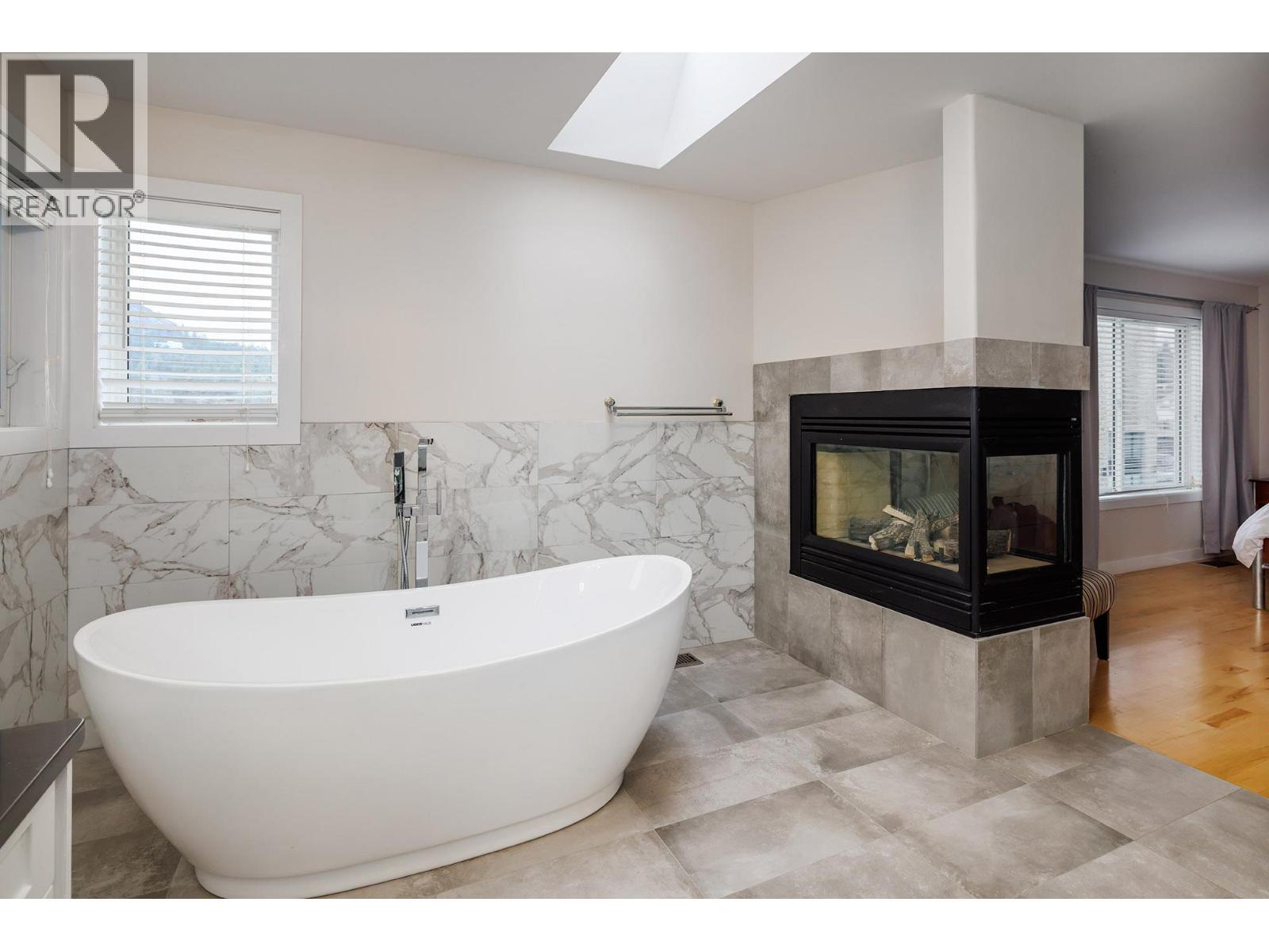 2761 Olalla Road, West Kelowna, BC - Indoor Photo Showing Bathroom With Fireplace