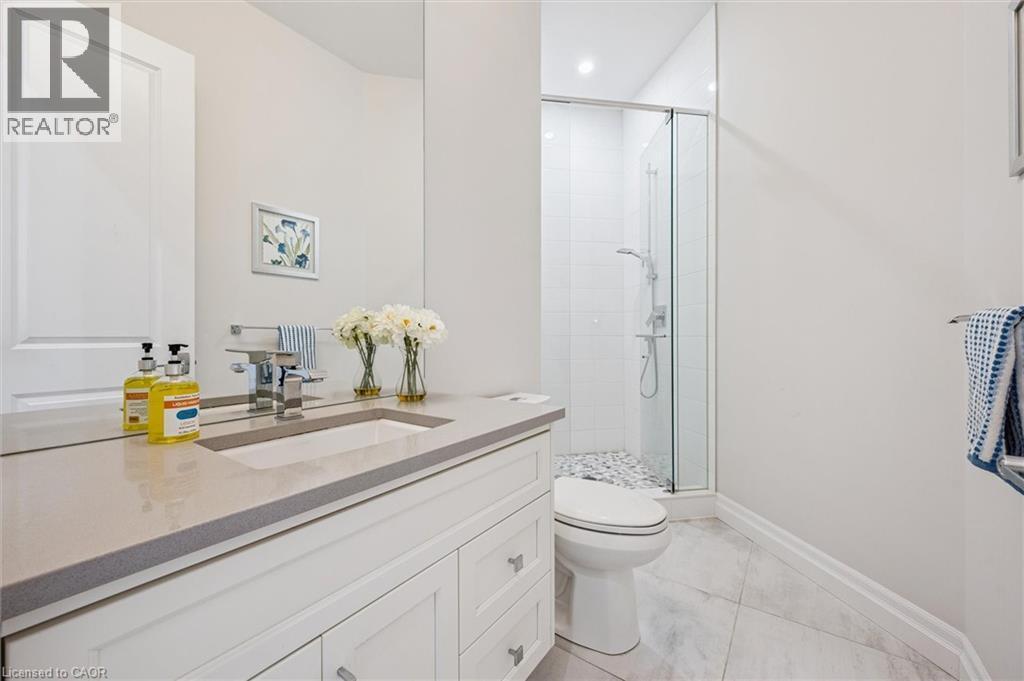 Full bathroom featuring a stall shower, vanity, recessed lighting, and light tile patterned floors - 263 Chestnut Ridge, Waterloo, ON - Indoor Photo Showing Bathroom