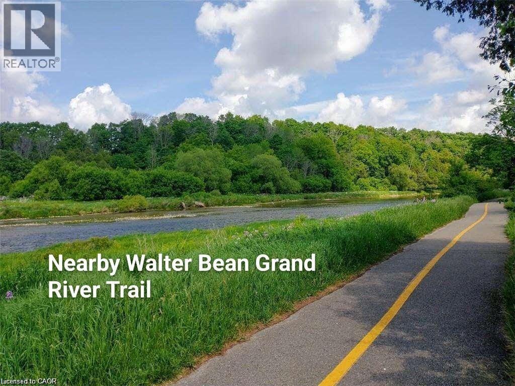 View of asphalt street with a forest view and a water view - 263 Chestnut Ridge, Waterloo, ON - Outdoor With View