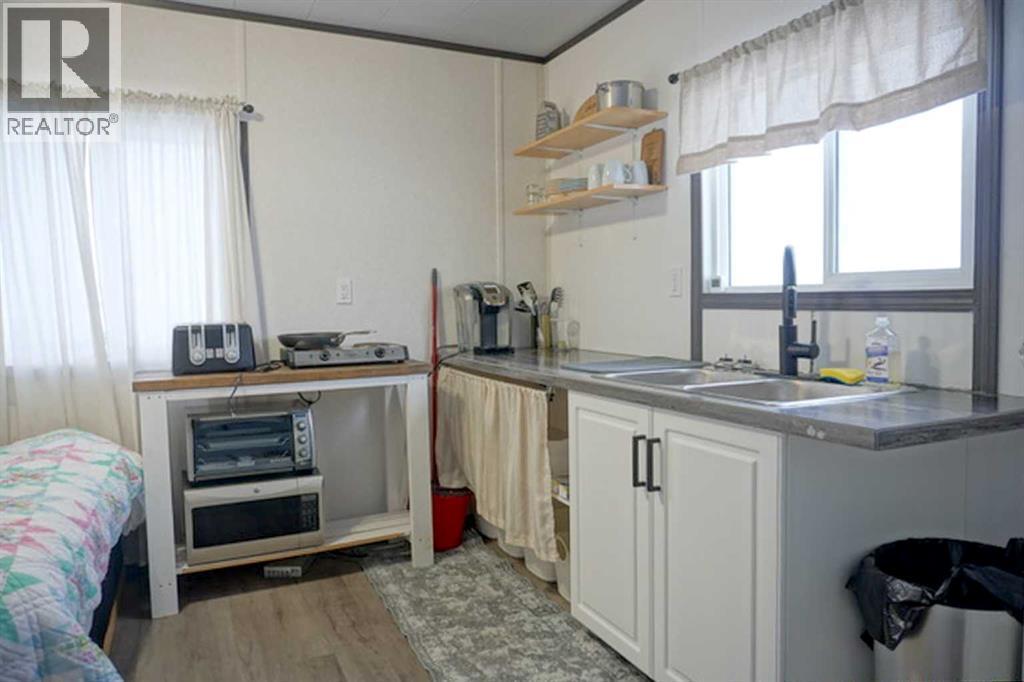 106157 Range Road 142, Rural Mackenzie County, AB - Indoor Photo Showing Kitchen With Double Sink