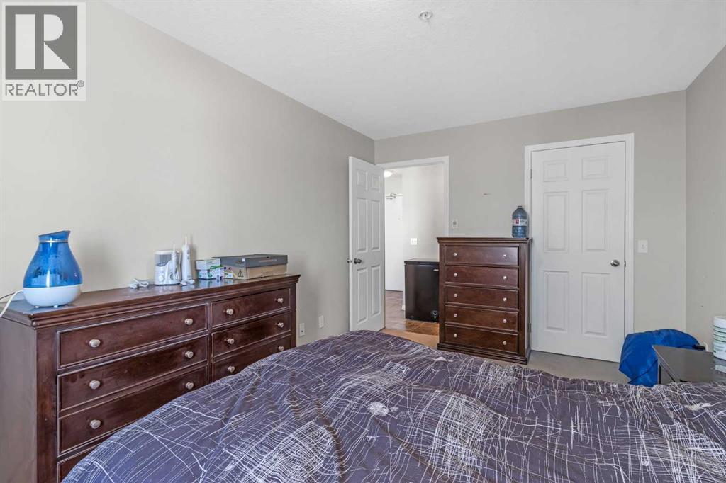 207, 1010 Railway Street, Crossfield, AB - Indoor Photo Showing Bedroom