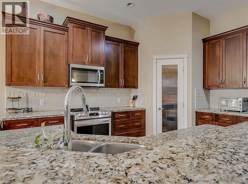 308 Lineham Acres Drive Nw, High River, AB - Indoor Photo Showing Kitchen With Double Sink